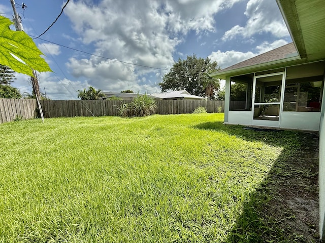 4480 SW Jaunt Rd, Port Saint Lucie, FL 34953 - view of yard with a sunroom