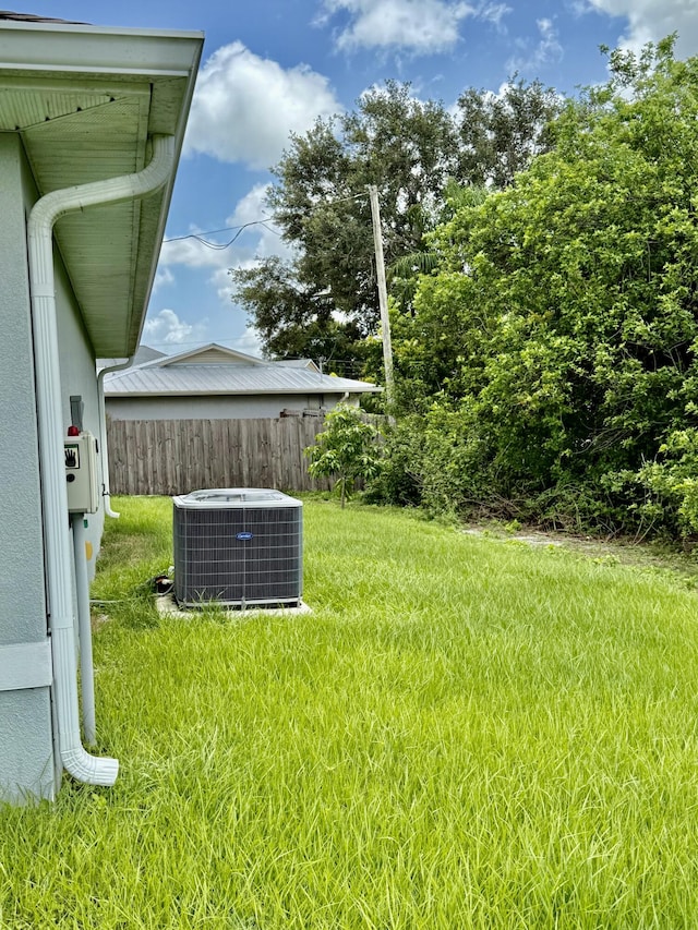 4480 SW Jaunt Rd, Port Saint Lucie, FL 34953 - view of yard with central air condition unit