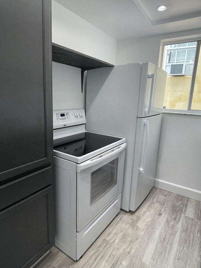 740 11th St Unit 3A, Miami Beach, FL 33139 - kitchen featuring white appliances, light wood-style flooring, baseboards, recessed lighting, and cooling unit