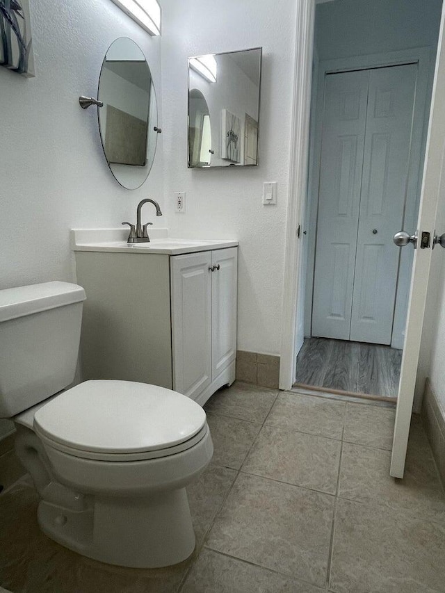 740 11th St Unit 3A, Miami Beach, FL 33139 - bathroom featuring toilet, vanity, and tile patterned floors