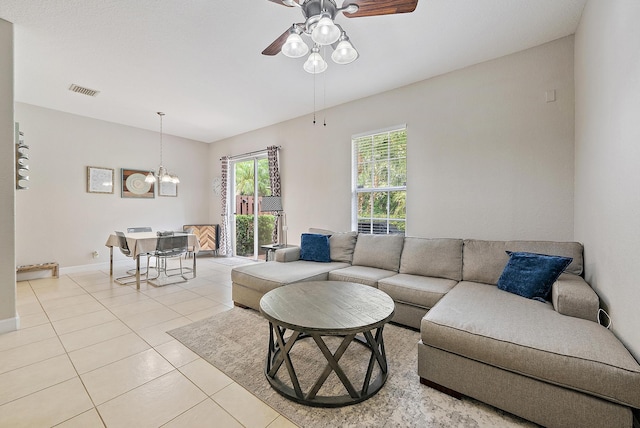 2788 Eagle Rock Cir Unit 3, West Palm Beach, FL 33411 - living area with a ceiling fan, light tile patterned flooring, a chandelier, and baseboards