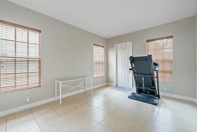 2788 Eagle Rock Cir Unit 3, West Palm Beach, FL 33411 - exercise room featuring baseboards and light tile patterned flooring