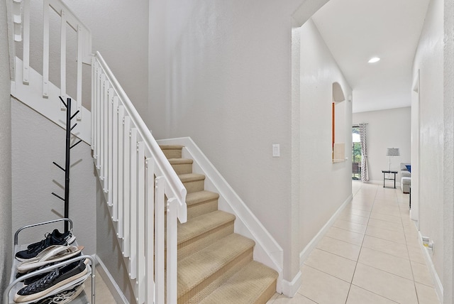 2788 Eagle Rock Cir Unit 3, West Palm Beach, FL 33411 - stairs featuring tile patterned flooring, arched walkways, baseboards, and recessed lighting