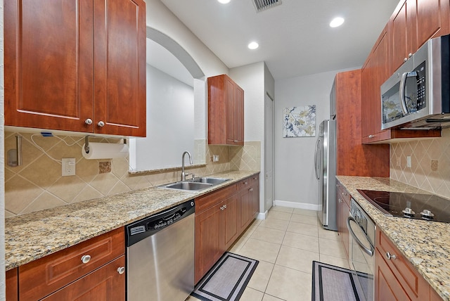 2788 Eagle Rock Cir Unit 3, West Palm Beach, FL 33411 - kitchen featuring stainless steel appliances, a sink, decorative backsplash, light stone counters, and recessed lighting