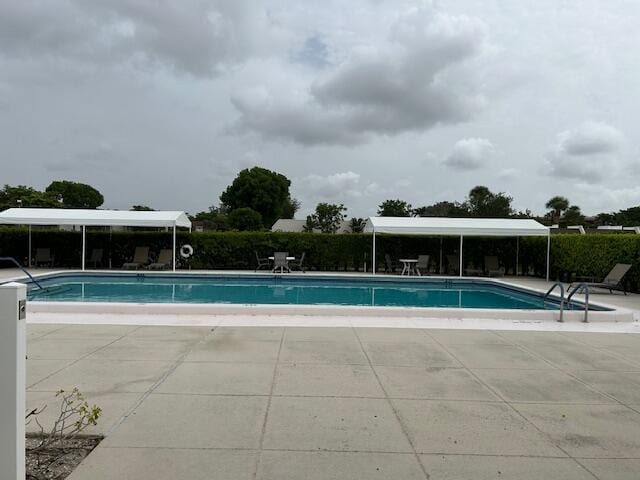 100 Lake Terry Dr, West Palm Beach, FL 33411 - community pool with a patio area