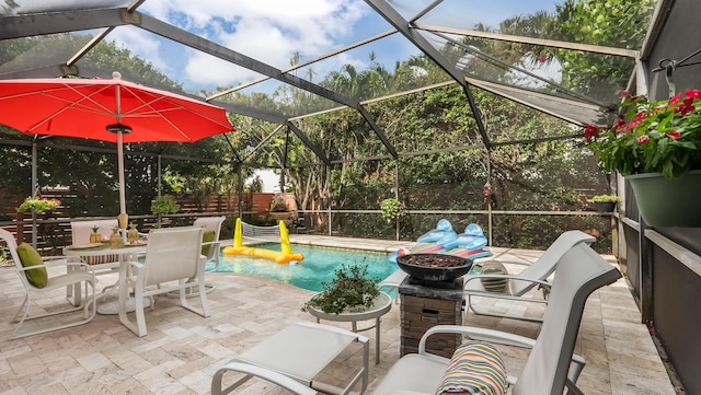 21596 Magdalena Ter, Boca Raton, FL 33433 - view of patio / terrace featuring outdoor dining space and glass enclosure