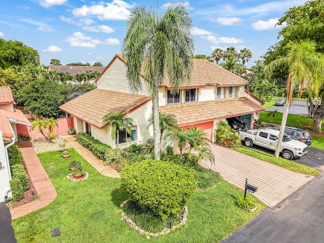 21596 Magdalena Ter, Boca Raton, FL 33433 - mediterranean / spanish home featuring stucco siding, a tile roof, a front yard, and driveway