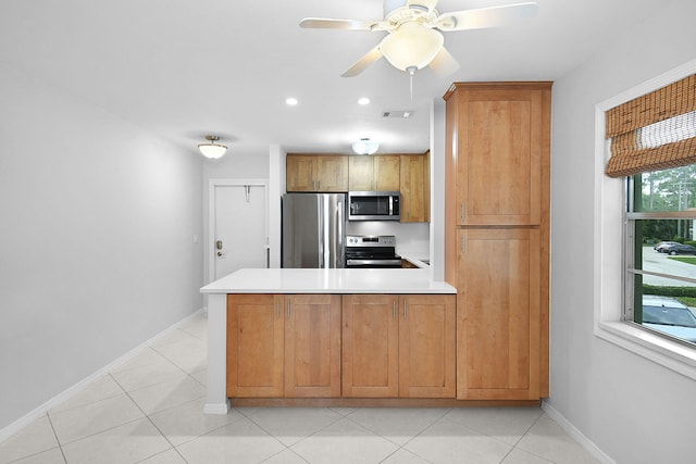 2600 SE Ocean Blvd Unit S15, Stuart, FL 34996 - kitchen with appliances with stainless steel finishes, a peninsula, light countertops, ceiling fan, and recessed lighting