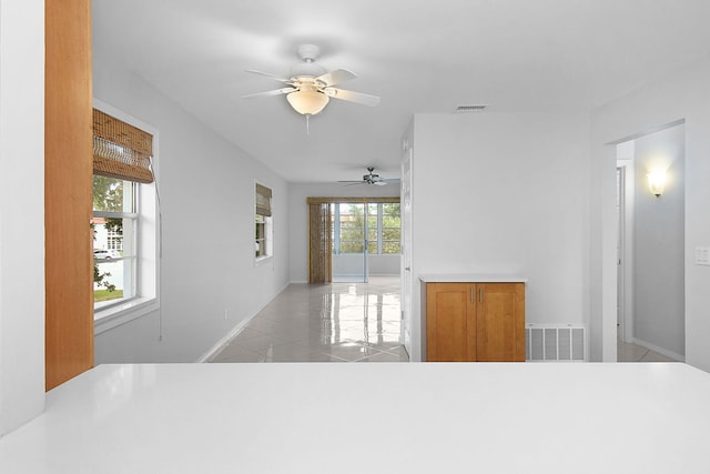 2600 SE Ocean Blvd Unit S15, Stuart, FL 34996 - unfurnished living room with a ceiling fan and light tile patterned floors