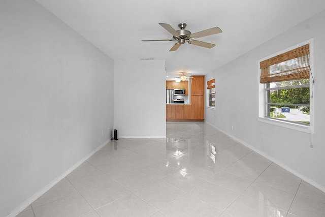 2600 SE Ocean Blvd Unit S15, Stuart, FL 34996 - unfurnished living room with light tile patterned floors and ceiling fan
