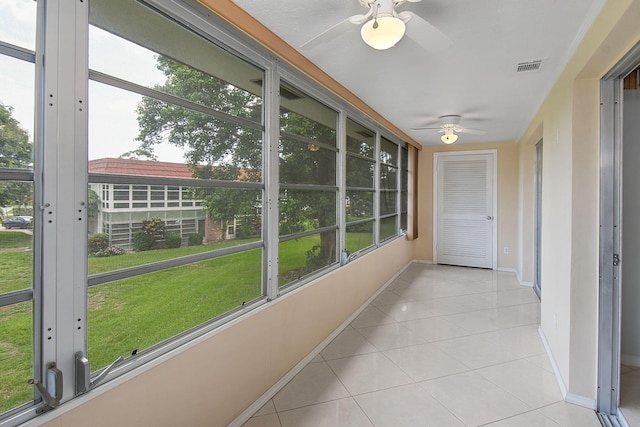 2600 SE Ocean Blvd Unit S15, Stuart, FL 34996 - unfurnished sunroom featuring a ceiling fan and healthy amount of natural light