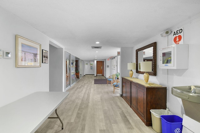 2600 SE Ocean Blvd Unit S15, Stuart, FL 34996 - hall featuring light wood-style floors and recessed lighting