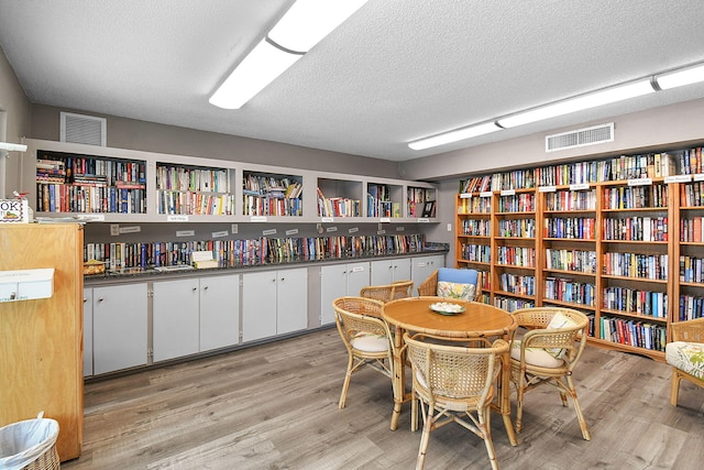 2600 SE Ocean Blvd Unit S15, Stuart, FL 34996 - dining space with light wood-style floors and a textured ceiling