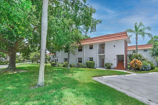 2600 SE Ocean Blvd Unit S15, Stuart, FL 34996 - view of building exterior with uncovered parking and stairs
