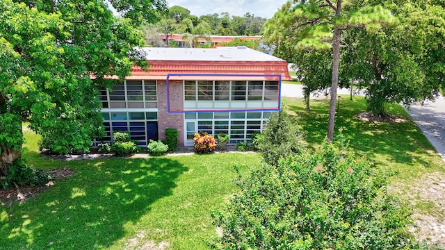 2600 SE Ocean Blvd Unit S15, Stuart, FL 34996 - back of property featuring a yard and brick siding