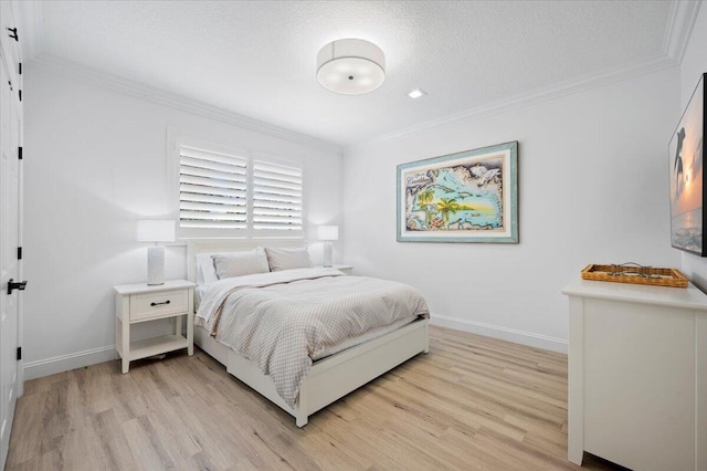 402 Sea Oats Dr Unit F, Juno Beach, FL 33408 - bedroom featuring ornamental molding, light wood finished floors, and baseboards