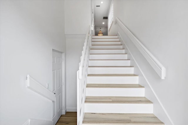 402 Sea Oats Dr Unit F, Juno Beach, FL 33408 - stairs featuring wood finished floors