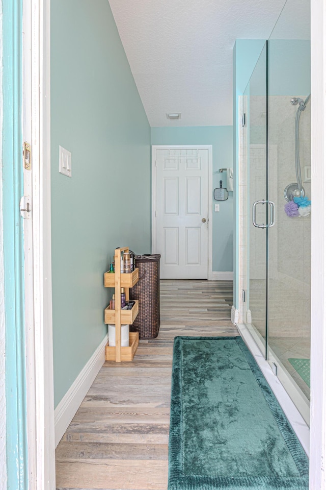16330 Wiltshire Dr E, Loxahatchee, FL 33470 - full bath featuring wood finished floors and a shower stall