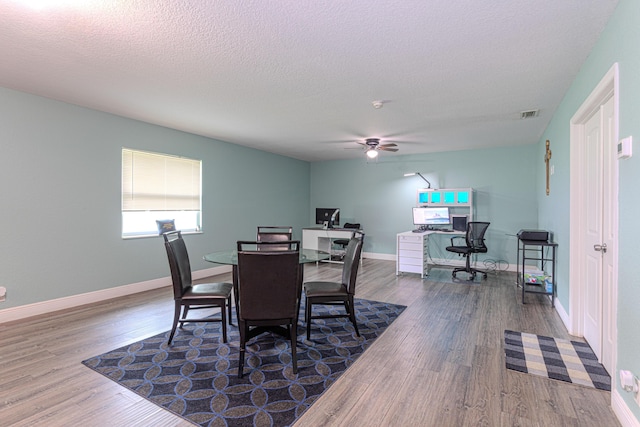 16330 Wiltshire Dr E, Loxahatchee, FL 33470 - dining area with wood finished floors, a ceiling fan, and a textured ceiling