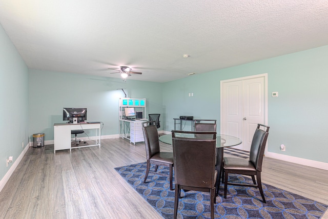 16330 Wiltshire Dr E, Loxahatchee, FL 33470 - dining space featuring wood finished floors, a ceiling fan, an office area, and a textured ceiling