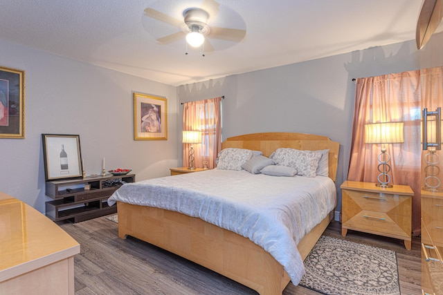 16330 Wiltshire Dr E, Loxahatchee, FL 33470 - bedroom with wood finished floors and ceiling fan