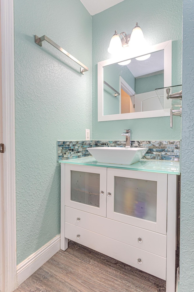 16330 Wiltshire Dr E, Loxahatchee, FL 33470 - bathroom with a textured wall, wood finished floors, and vanity