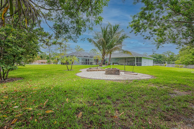 16330 Wiltshire Dr E, Loxahatchee, FL 33470 - view of yard featuring glass enclosure and a patio area