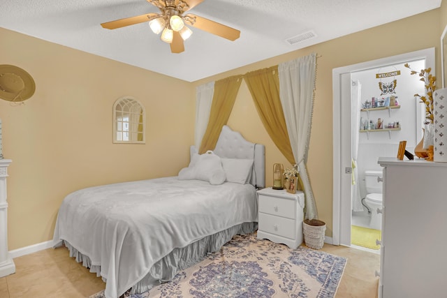5780 W Fernley Dr Unit 101, West Palm Beach, FL 33415 - bedroom with a ceiling fan, light tile patterned floors, and a textured ceiling