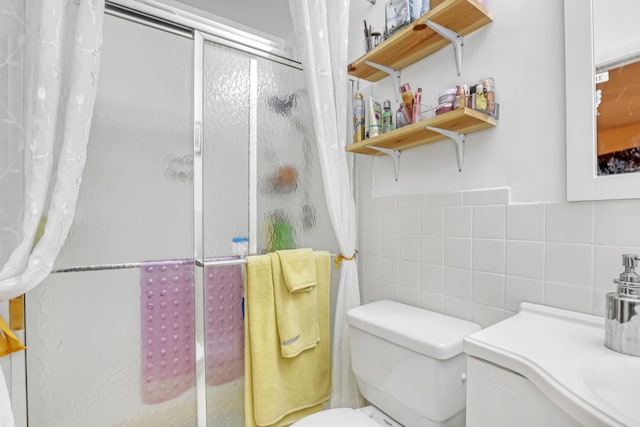 5780 W Fernley Dr Unit 101, West Palm Beach, FL 33415 - full bathroom with a stall shower, tile walls, toilet, and vanity