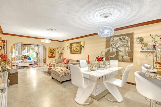 5780 W Fernley Dr Unit 101, West Palm Beach, FL 33415 - dining space featuring arched walkways, a textured ceiling, light tile patterned floors, and ornamental molding