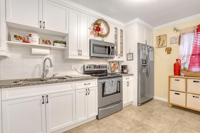 5780 W Fernley Dr Unit 101, West Palm Beach, FL 33415 - kitchen with appliances with stainless steel finishes, a sink, tasteful backsplash, light stone countertops, and white cabinetry