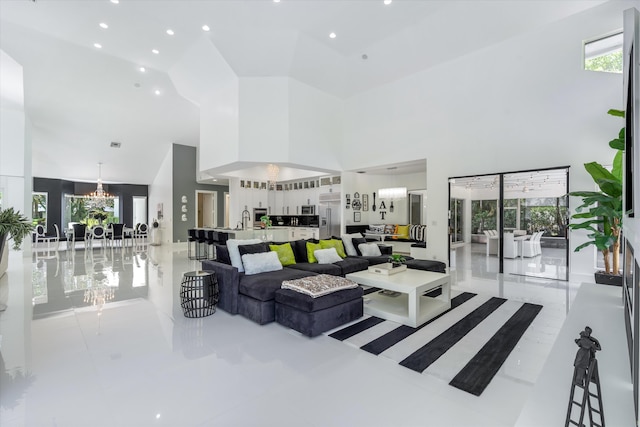 8076 Twin Lake Dr, Boca Raton, FL 33496 - living room with a towering ceiling and a chandelier