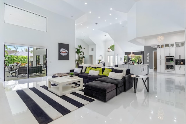 8076 Twin Lake Dr, Boca Raton, FL 33496 - living area featuring high vaulted ceiling, a chandelier, light tile patterned floors, recessed lighting, and plenty of natural light