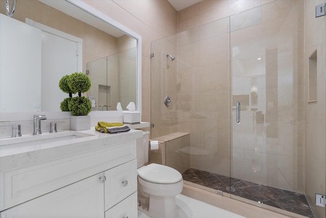 8076 Twin Lake Dr, Boca Raton, FL 33496 - bathroom featuring toilet, a shower stall, and vanity