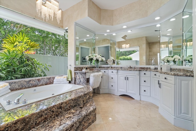 8076 Twin Lake Dr, Boca Raton, FL 33496 - bathroom featuring a whirlpool tub, double vanity, and recessed lighting