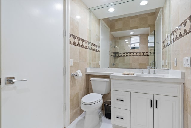 8076 Twin Lake Dr, Boca Raton, FL 33496 - full bathroom featuring tile walls, toilet, vanity, tiled shower, and recessed lighting