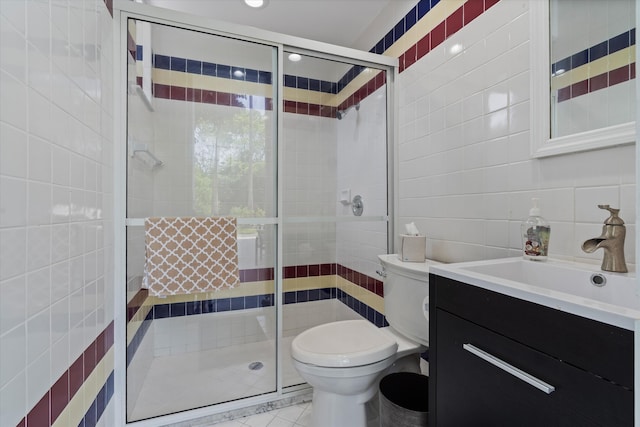 8076 Twin Lake Dr, Boca Raton, FL 33496 - bathroom with tile walls, vanity, toilet, a shower stall, and tasteful backsplash
