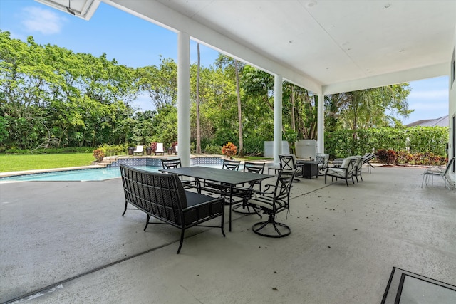 8076 Twin Lake Dr, Boca Raton, FL 33496 - view of patio featuring outdoor dining space and view of scattered trees