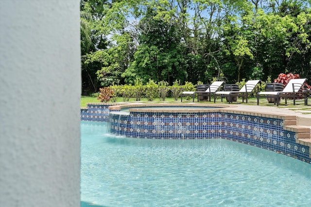 8076 Twin Lake Dr, Boca Raton, FL 33496 - swimming pool with a hot tub and view of wooded area