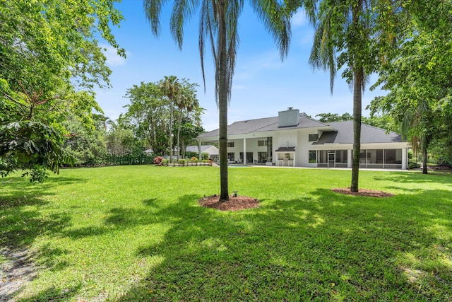 8076 Twin Lake Dr, Boca Raton, FL 33496 - view of green lawn featuring a sunroom