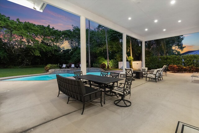 8076 Twin Lake Dr, Boca Raton, FL 33496 - patio terrace at dusk with a patio area and an outdoor pool