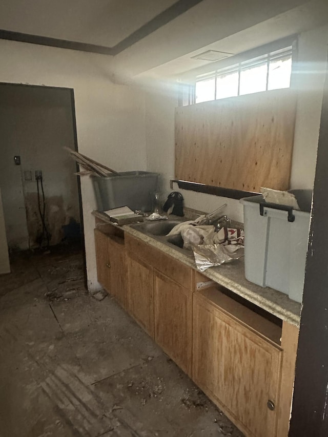 1457 W 32nd St, Riviera Beach, FL 33404 - kitchen featuring brown cabinets