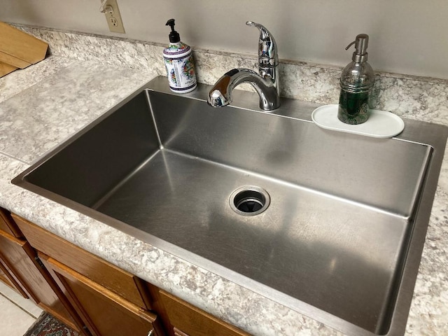 1920 Westminster Cir Unit 6, Vero Beach, FL 32966 - kitchen view of a sink, brown cabinets, and light countertops
