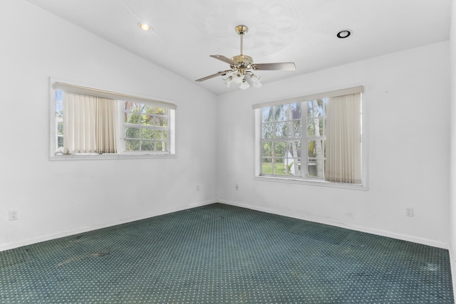 14685 40th St N, Loxahatchee Groves, FL 33470 - spare room with dark carpet, a ceiling fan, vaulted ceiling, baseboards, and recessed lighting