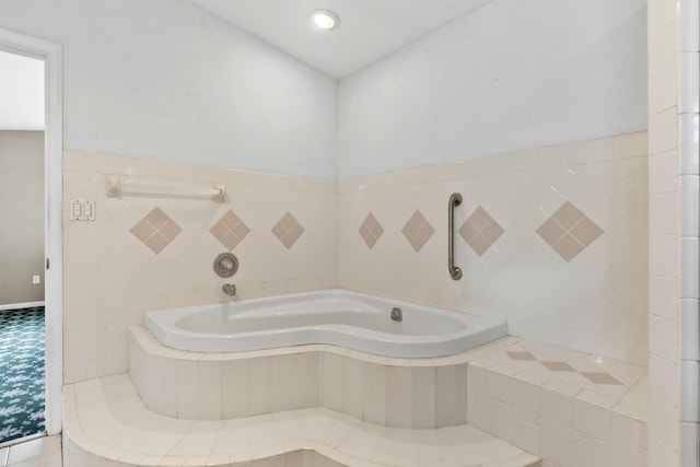14685 40th St N, Loxahatchee Groves, FL 33470 - bathroom featuring a bath, tile walls, recessed lighting, and wainscoting