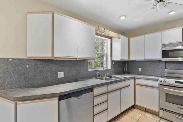 14685 40th St N, Loxahatchee Groves, FL 33470 - kitchen with appliances with stainless steel finishes, a sink, and white cabinets
