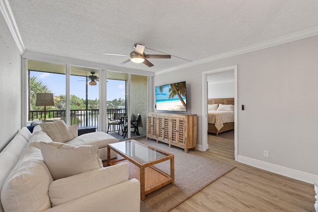 22 Royal Palm Way Unit 205, Boca Raton, FL 33432 - living area with ornamental molding, a ceiling fan, wood finished floors, and a textured ceiling