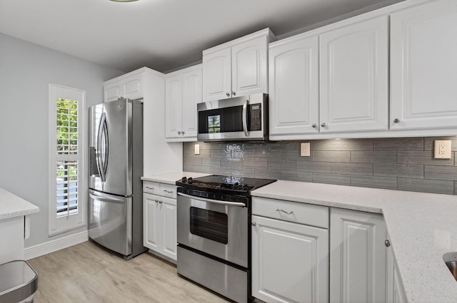 22 Royal Palm Way Unit 205, Boca Raton, FL 33432 - kitchen with stainless steel appliances, light wood-type flooring, and white cabinetry