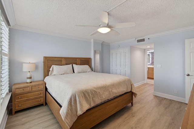 22 Royal Palm Way Unit 205, Boca Raton, FL 33432 - bedroom featuring ornamental molding, a textured ceiling, light wood-style flooring, and ceiling fan