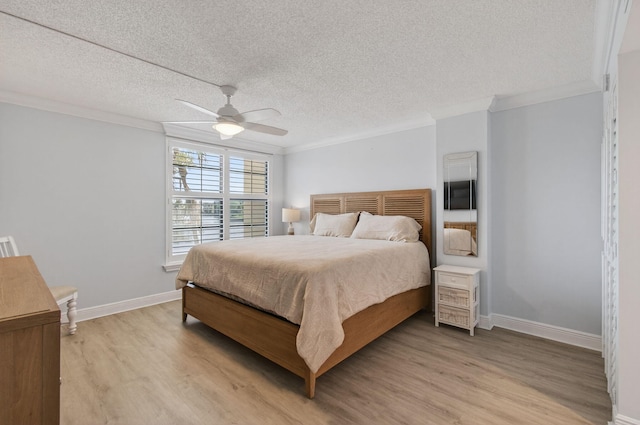 22 Royal Palm Way Unit 205, Boca Raton, FL 33432 - bedroom featuring crown molding, light wood-type flooring, a textured ceiling, and a ceiling fan